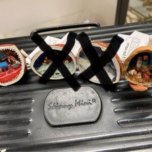 walnut shells decorated with miniature scenes.